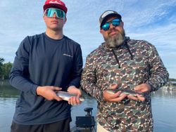 Two rainbow trout caught while fishing in Branson