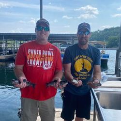 Two people fishing in Branson