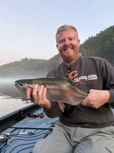 Angler with a rainbow trout in Branson