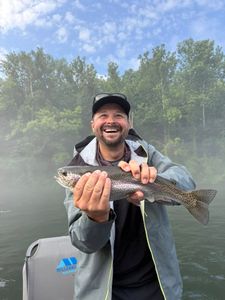 Angler with a rainbow trout in MO