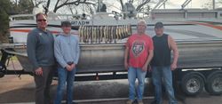 Four people fishing at the Academy