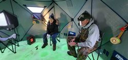 Two people enjoying fishing at the Academy