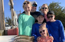 A group of 6 people fishing in FL