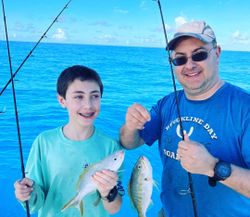 Two people fishing on the beach in Marathon, Florida