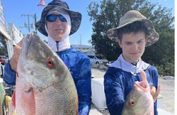 Two fishermen with big fish in Marathon, Florida