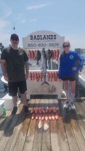 Two people fishing on the coast of FL