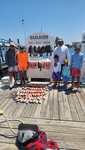 Six people fishing on the shore in FL