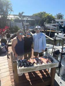 Three anglers enjoying a fishing trip in Florida