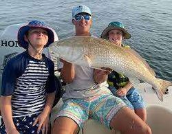 A group of 3 people fishing in Florida