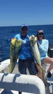 Two people fishing with rods in West Palm Beach