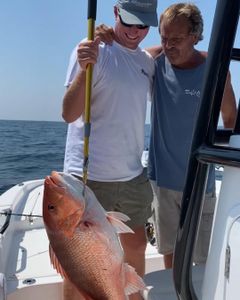 Two people fishing at Gulf Shores