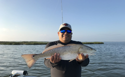 Radiate Joy with Redfish Fishing in Port Aransas.