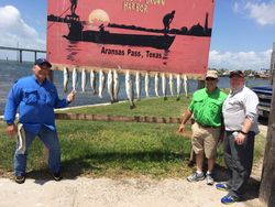 A group of 3 people fishing in TX