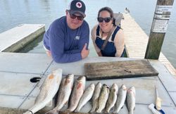Two people fishing in the waters of Port Aransas