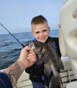 Angler catching a sea bass in Yarmouth