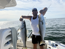 Nice pair of stripers using deep sea jigging and trolling techniques in clear conditions!