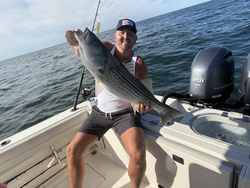 Nice striped bass caught with deep sea jigging in clear conditions off Yarmouth MA!