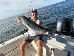 Nice striped bass caught using deep sea jigging techniques in clear conditions!
