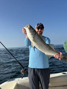 Striped bass action in Yarmouth: deep sea jigging and trolling under clear skies!