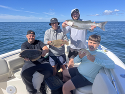 Big striped bass and flounders hooked on a clear day in Yarmouth!
