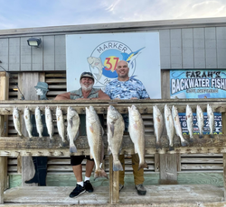 Impressive catch of 14 redfish, black drum, and spotted weakfish at Corpus Christi