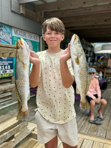 Two spotted weakfish caught while fishing in TX