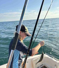 Fishing from boat in Islamorada FL with caught fish on line