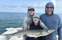 A Great Barracuda fish caught by three people in Islamorada