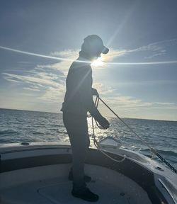 Fishing from boat deck in Islamorada FL waters with net equipment