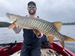 A person fishing in Minocqua with a great catch