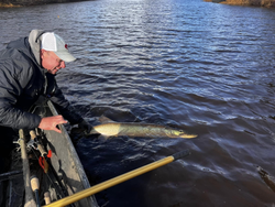 Lone angler fishing in Minocqua, enjoying the great outdoors