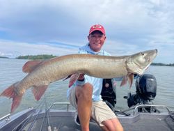 A person fishing for a muskellunge in Minocqua