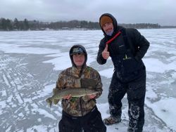 Northern pike caught ice fishing on frozen lake in Minocqua Wisconsin
