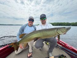 A trio of anglers fishing for a trophy muskellunge in Minocqua