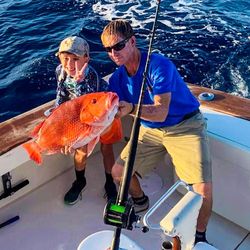 Two anglers fishing on the coast of FL