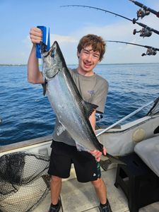 Large Chinook salmon catch displayed on fishing boat deck in Port Washington WI