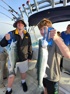 Two coho salmon caught during fishing charter in Port Washington WI