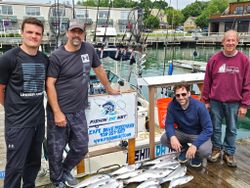 Four people enjoying a cruises and fishing trip in Port Washington.