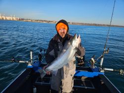 Two people fishing on a boat in Port Washington
