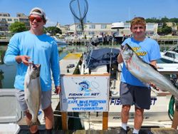 Two fishermen catch big fish in Port Washington
