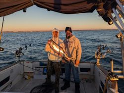 Two people enjoying a fishing cruise in Port Washington
