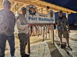 Three people enjoying a fishing cruise in Wisconsin