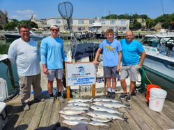 Four people enjoying cruises and fishing at Port Washington