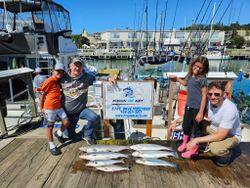 Group of 5 people fishing on the water in Port Washington