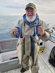 Two coho salmon caught during fishing charter in Port Washington WI