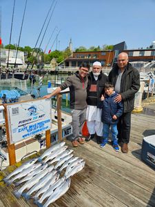 4 people enjoying a cruise and fishing expedition in Port Washington