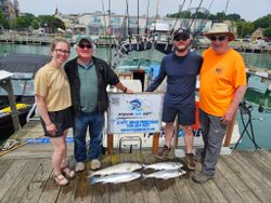 Successful fishing charter in Port Washington WI with fresh caught fish displayed on dock