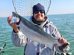 Angler with a single rainbow trout in Port Washington