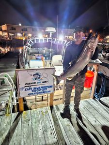A lone fisherman reeling in a big catch in Wisconsin