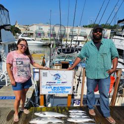 Two people fishing in Wisconsin, enjoying a cruises and fishing adventure